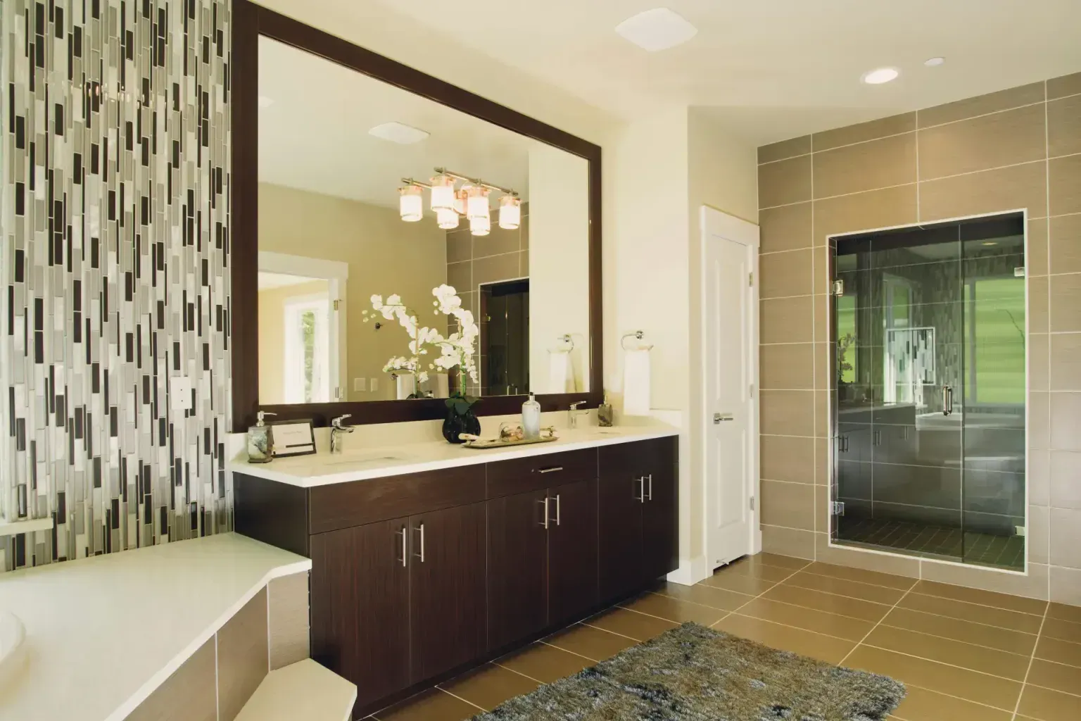 Bathroom remodel in Cibolo Tx — a tradesperson making a careful final pass over the finished work