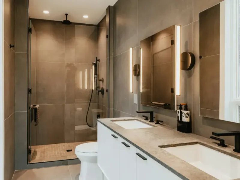 Bathroom remodel in San Antonio Tx — a spirit level held against the completed work with the bubble dead centre
