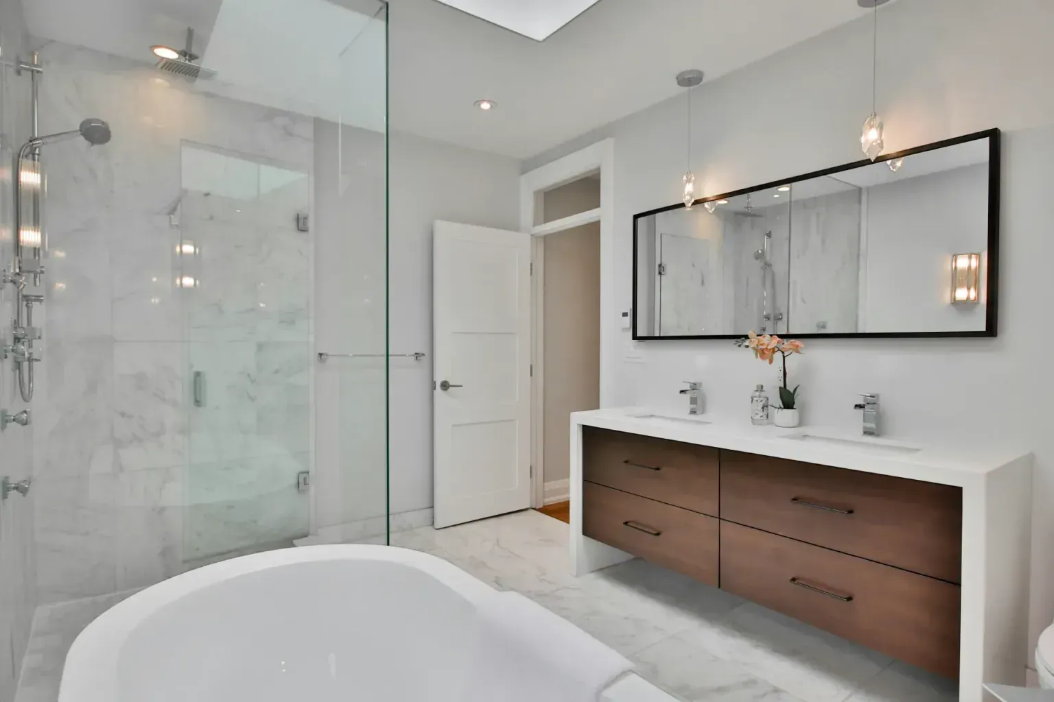 Bathroom remodel on a budget — a hand held flat against newly completed work to show how well it matches