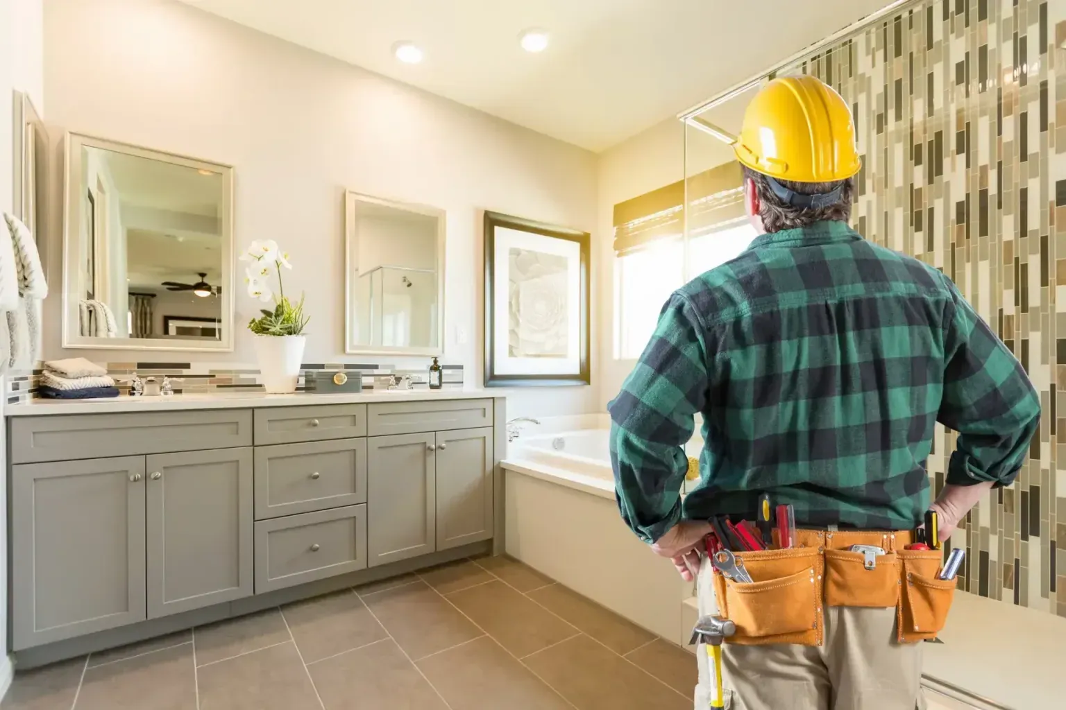 Bathroom renovation — clean unbroken lines of completed work running toward a commercial suite window
